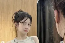 李尤比，穿着无袖上衣和羽绒服却显得… 