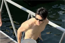 NCT Jaehyun Denies Dating Rumors Over Bikini Woman in Vacation Photos, Calls Her a “Cousin”